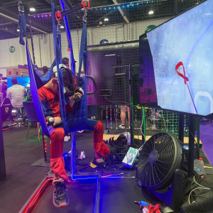 A boy enjoying a VR game at Comic Con 2025 for an immersive gaming experience.