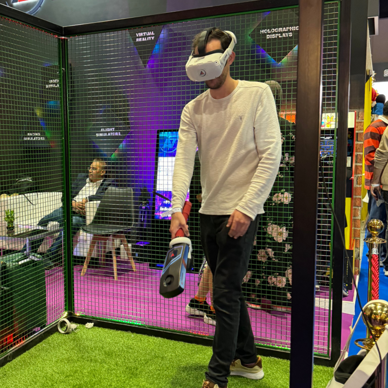 Person playing virtual reality game with VR headset and motion controllers in a modern gaming room